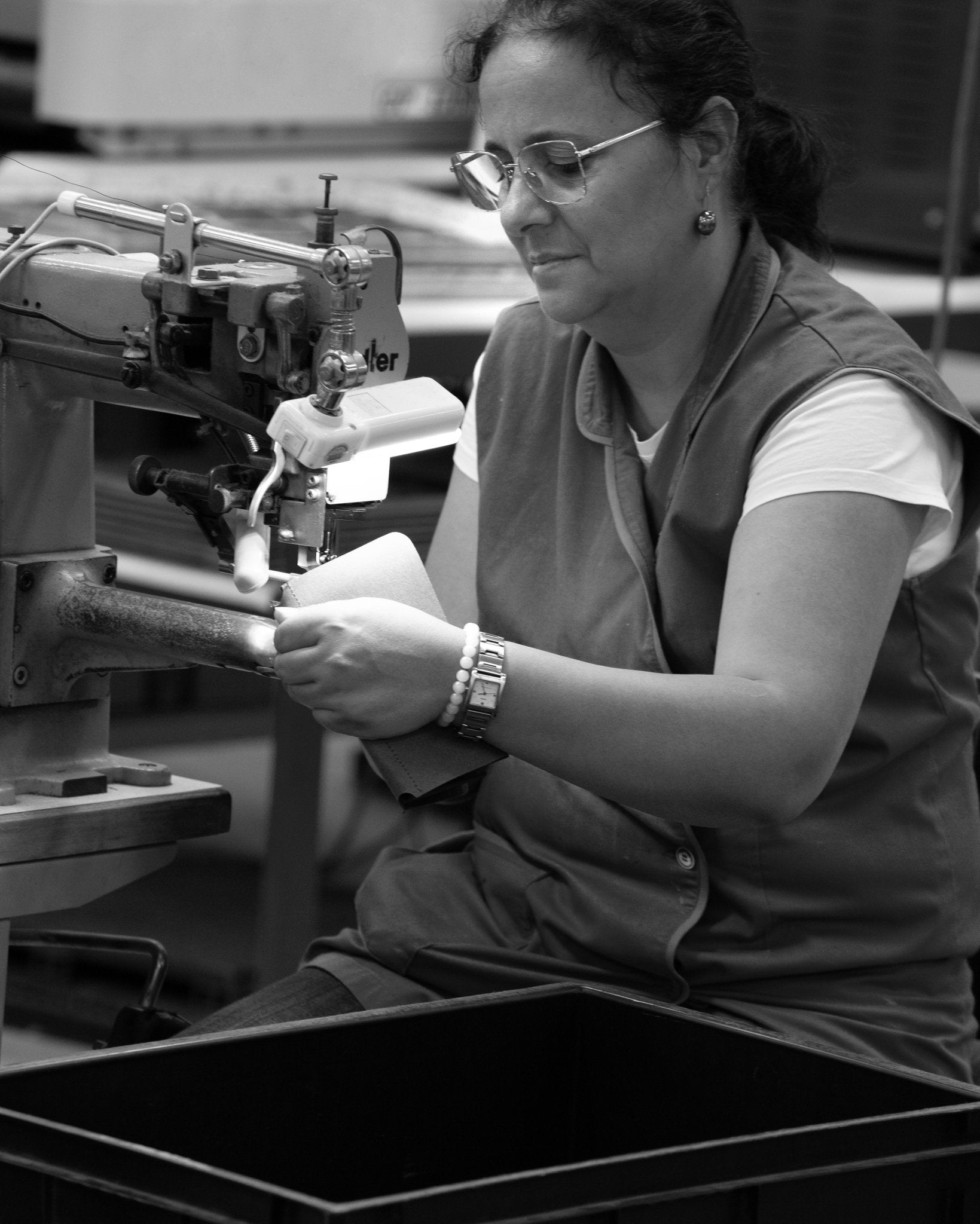 Artisan leather worker handstitching